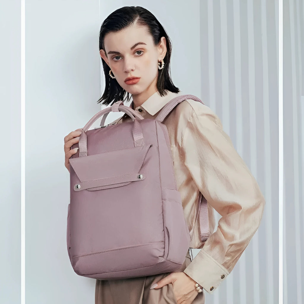 Lightweight large capacity schoolbag in solid colour waterproof nylon, unisex design for school or travel