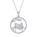 Close-up of a copper necklace featuring a pendant with four kittens in an original design, on a cross chain.