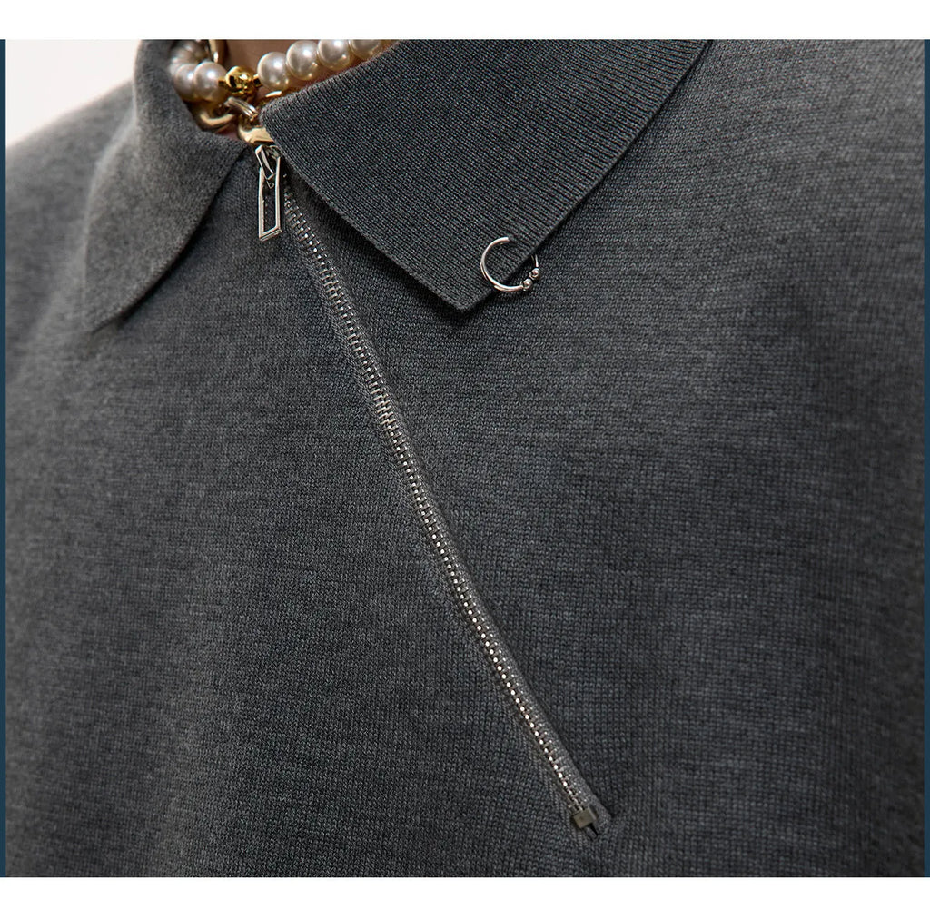 Slim fit grey knitted polo shirt with an oblique diagonal zip and short sleeves on a mannequin.