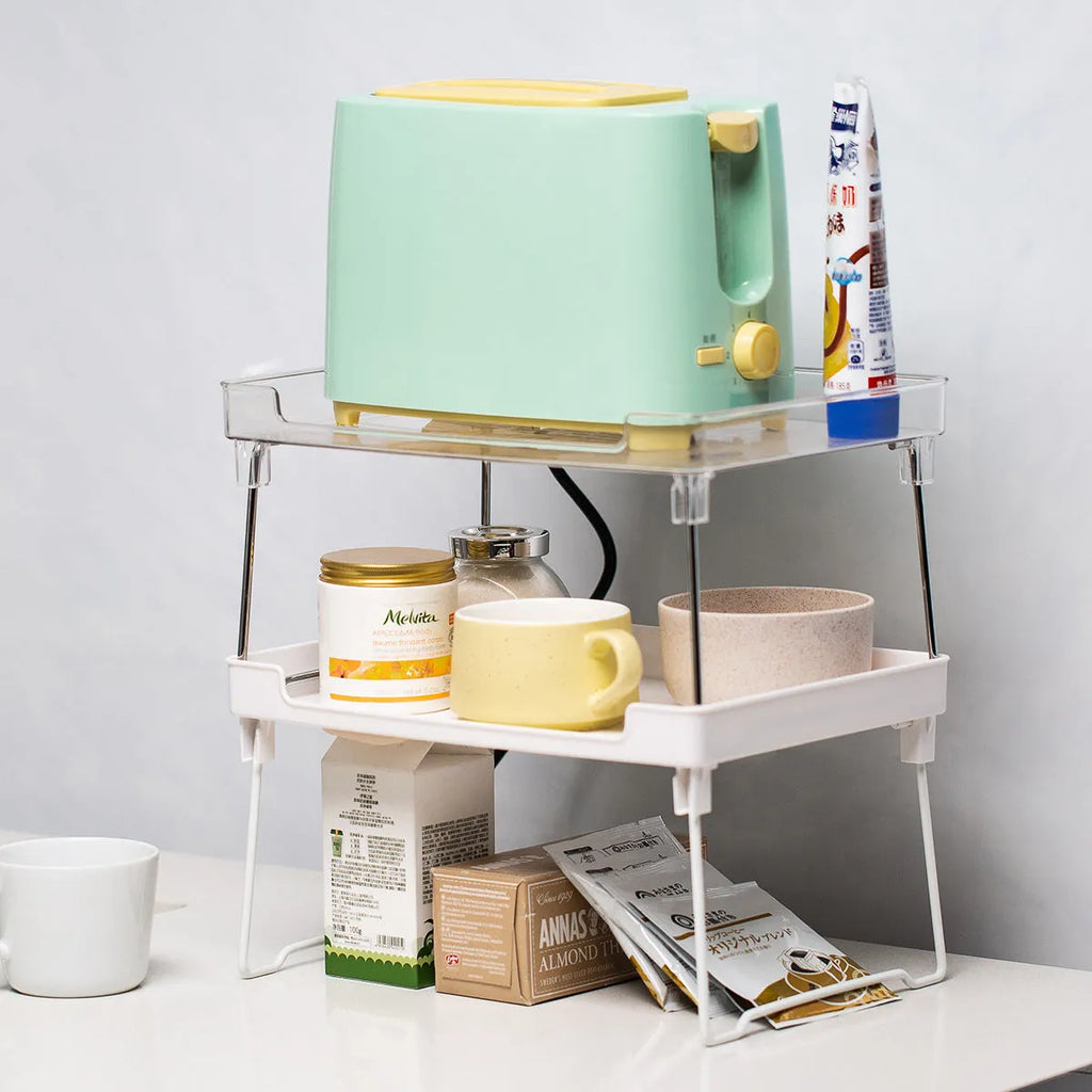 Plastic kitchen supplies rack on desktop, transparent finish, with assorted spice jars
