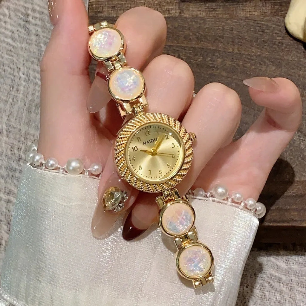 Women's quartz watch with 25mm round dial in zinc alloy case, showing spiral crown and choice of six colours.