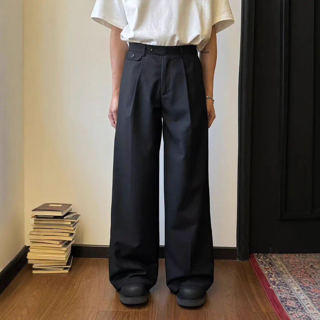 Men's brown straight-leg loose wide-leg casual suit trousers laid flat.