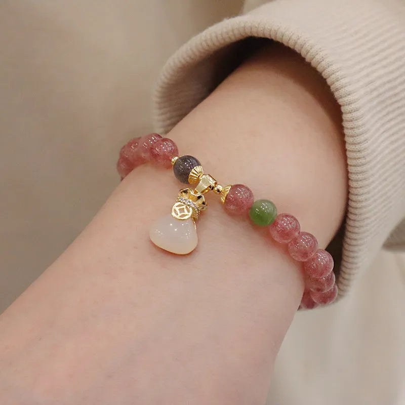 Geometric purse-style strawberry quartz bracelet for women with a peace buckle and safety clasp.