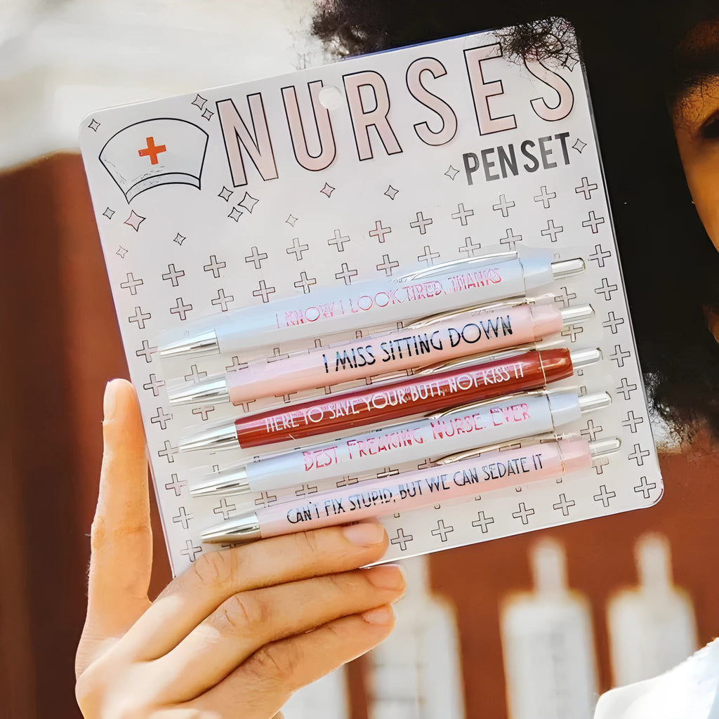 Set of five blue and pink nurse-themed retractable ballpoint pens on a white background.