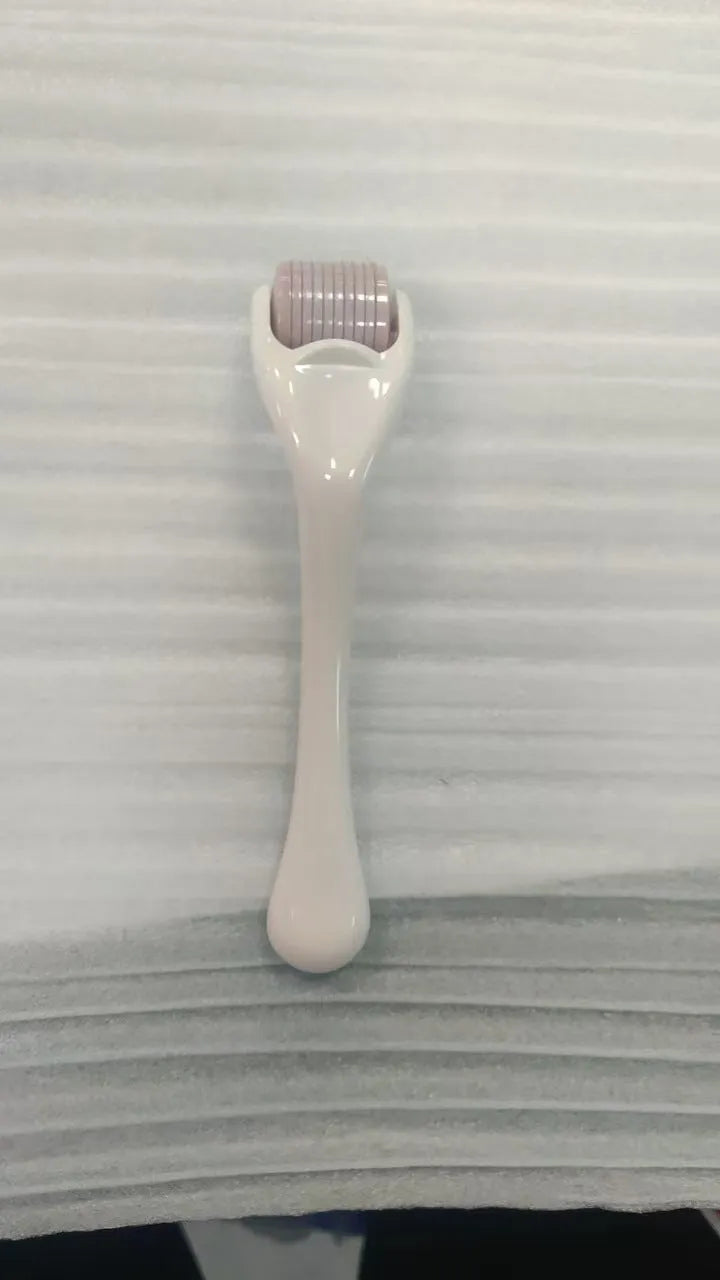 540 needle derma roller with black handle and coloured wheel, showing 0.25mm 0.3mm size options for micro-needling.