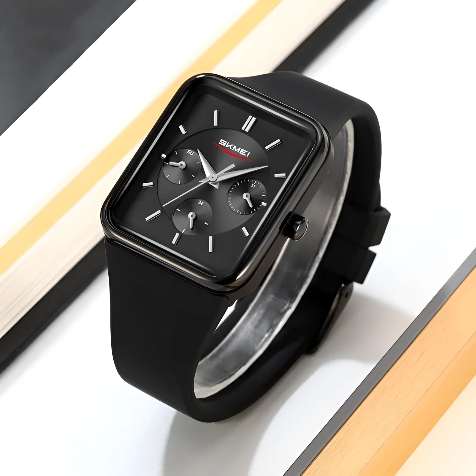 Multi functional square silicone waterproof watch for women, black gold colour, on wrist