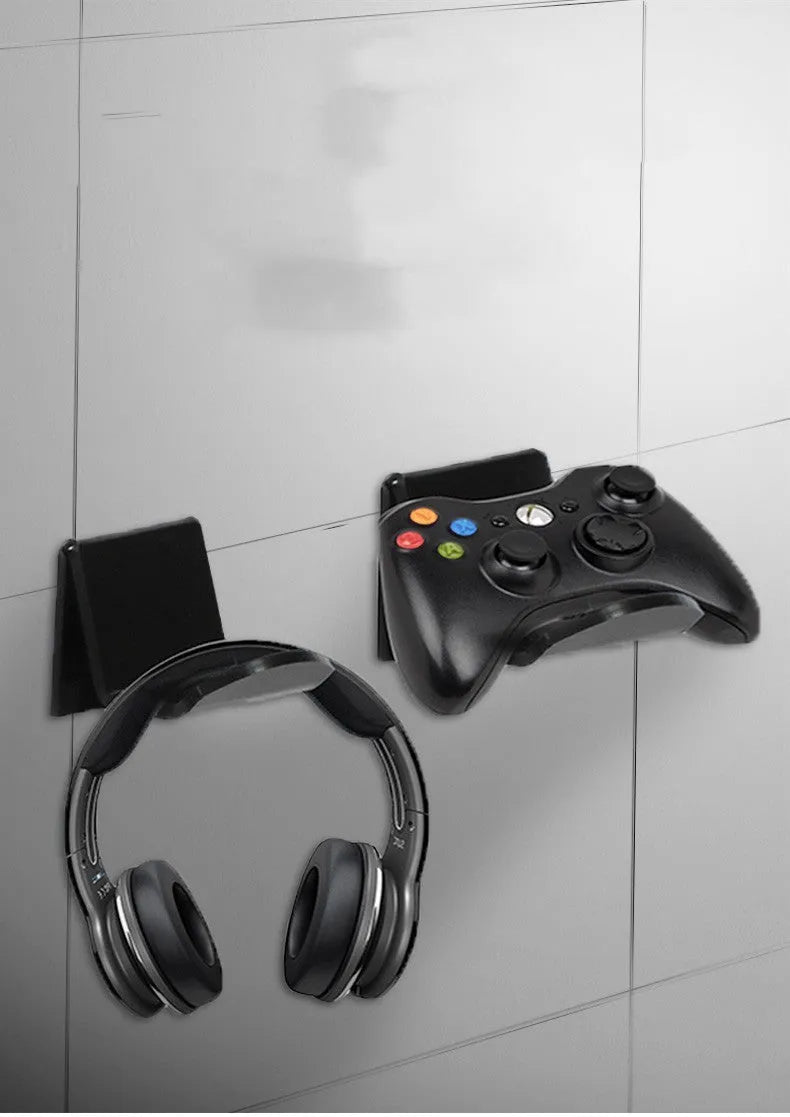 Universal game controller wall mount bracket holding PS5 DualSense controller in black plastic finish