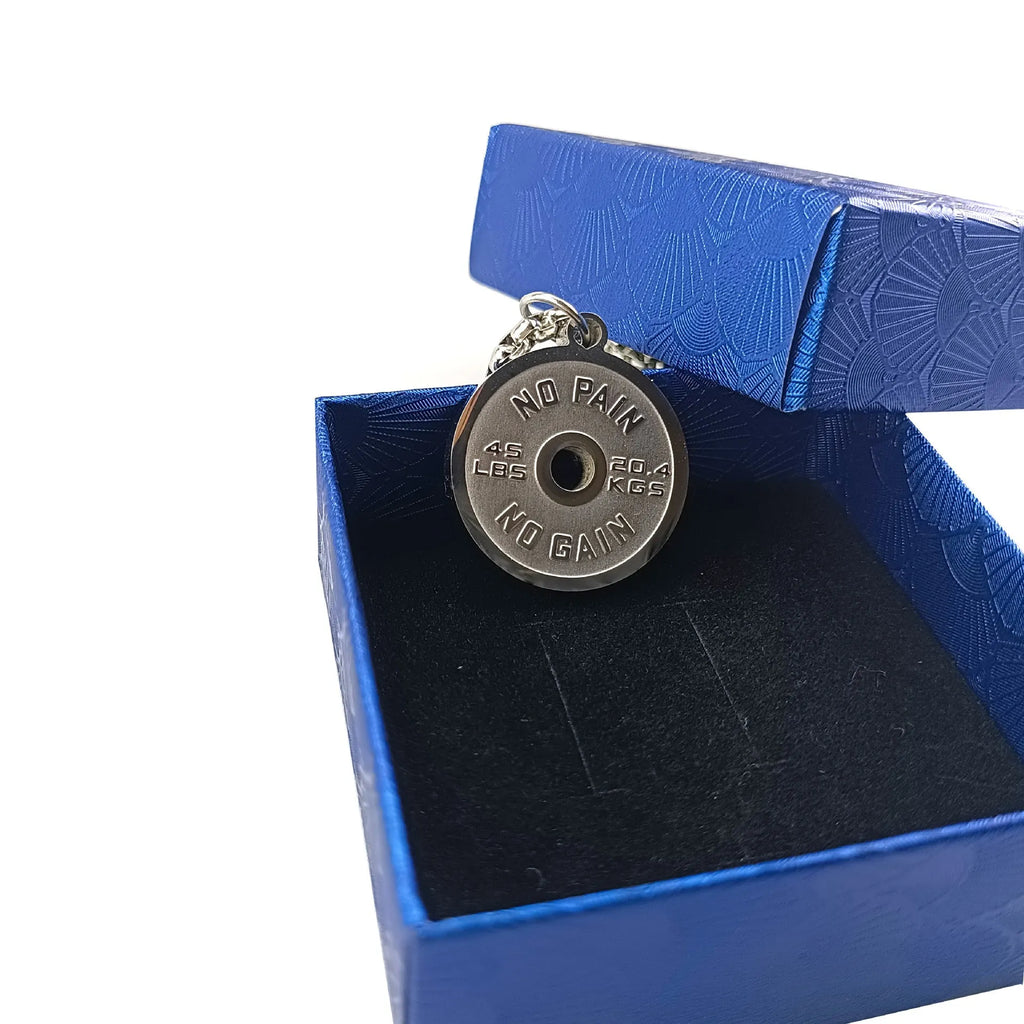 Polished stainless steel barbell disc pendant on a 60cm chain, showing geometric fitness jewellery design.