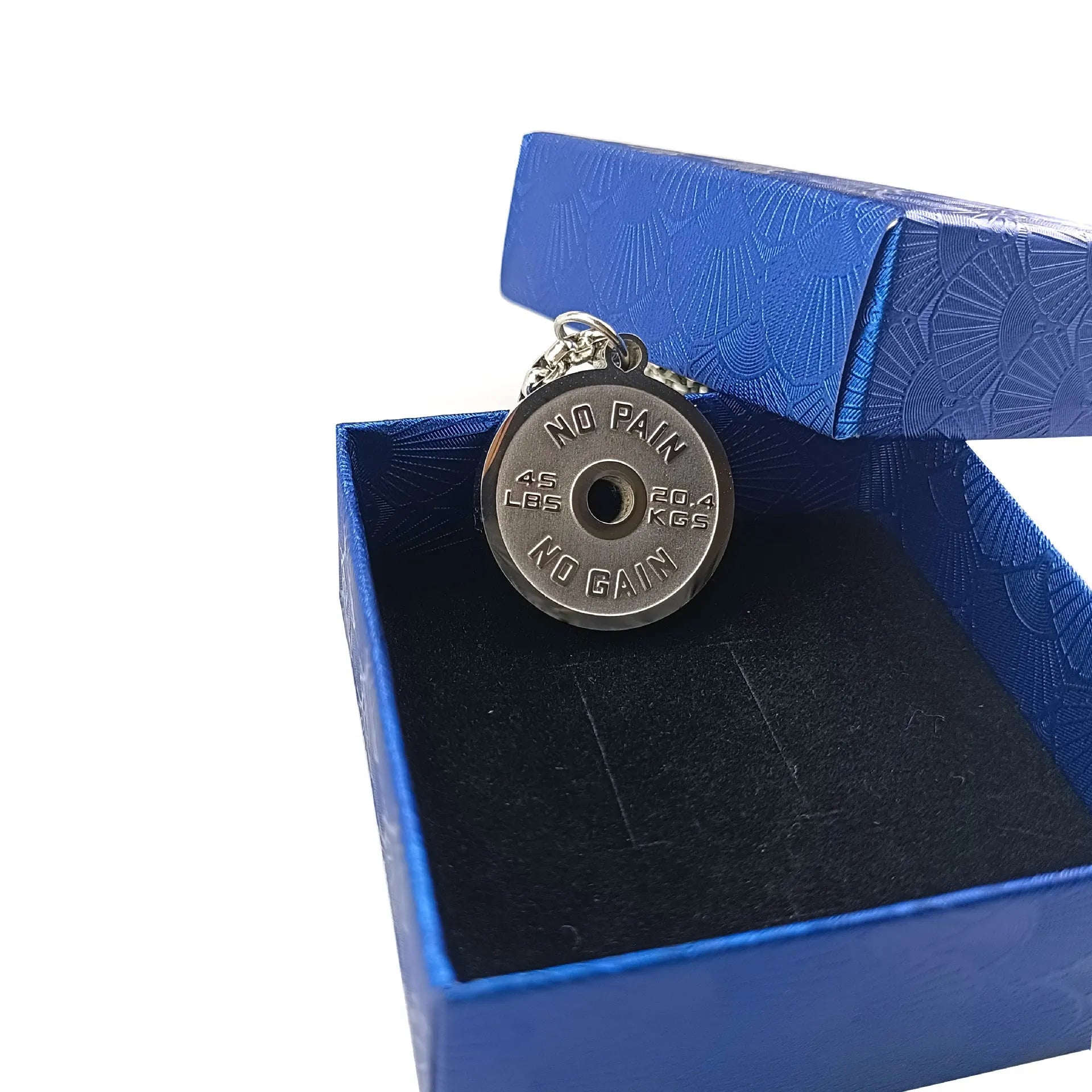 Polished stainless steel barbell disc pendant on a 60cm chain, showing geometric fitness jewellery design.