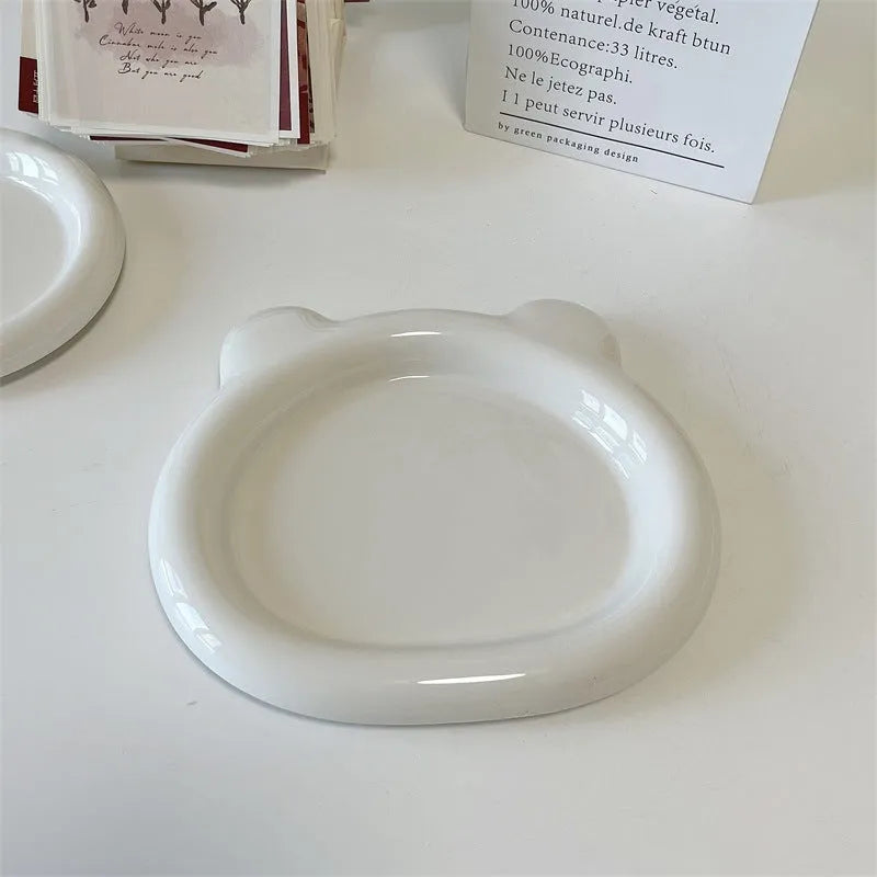 White porcelain plate with bear doodle design in round shape showing 15cm and 20cm size options