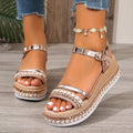 Women's woven wedge sandals in gold with round toe and PU upper, side view on neutral background