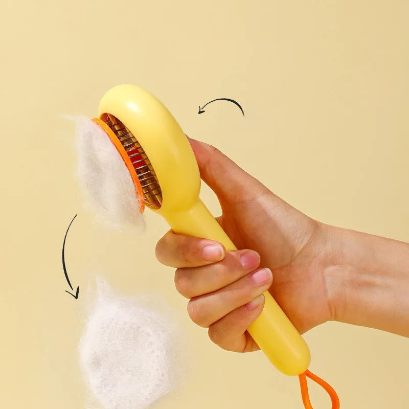 Small yellow duck-shaped pet comb for cat and dog grooming with needle teeth