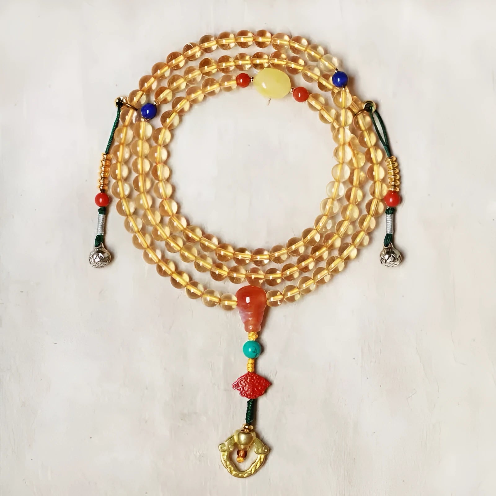 Natural citrine bracelet with red and yellow 1mm beads on filament string in light luxury style