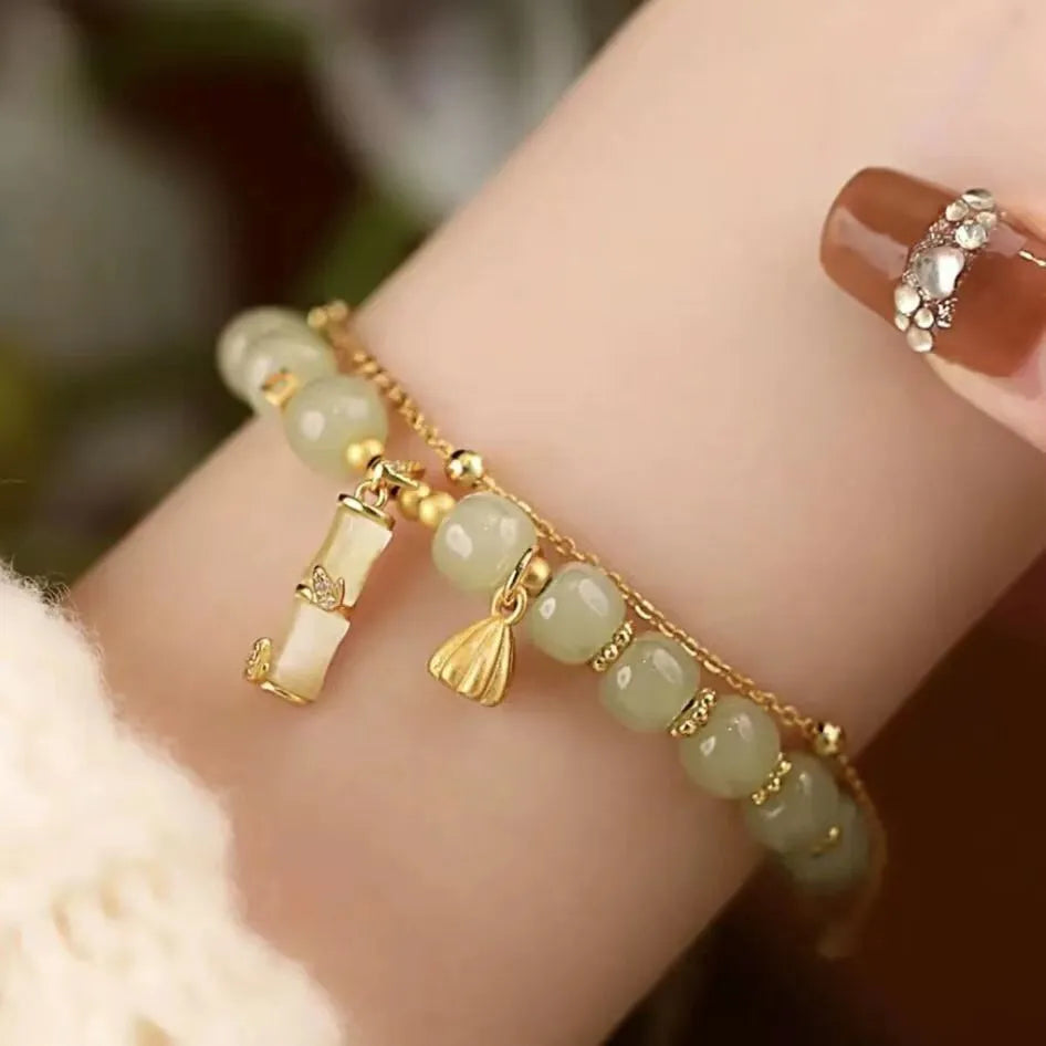 Bamboo special-design glass bracelet in beige with flower shape and Ruyi element, electroplated finish