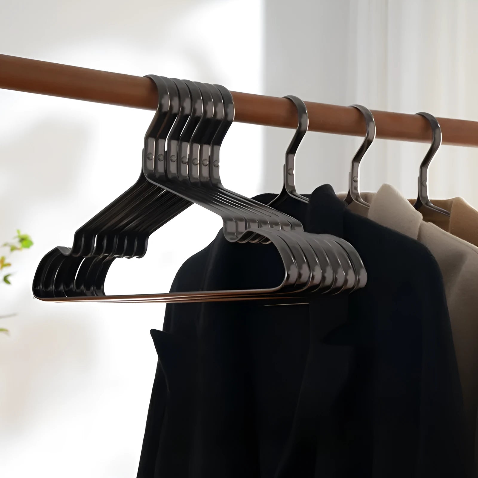 Modern black non-slip clothes hanger for anti-rust wardrobe organisation.