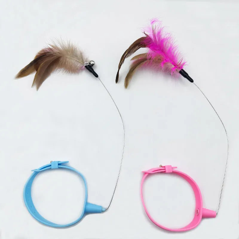 Blue collar cat teaser toy with feather and bell attachment on adjustable strap