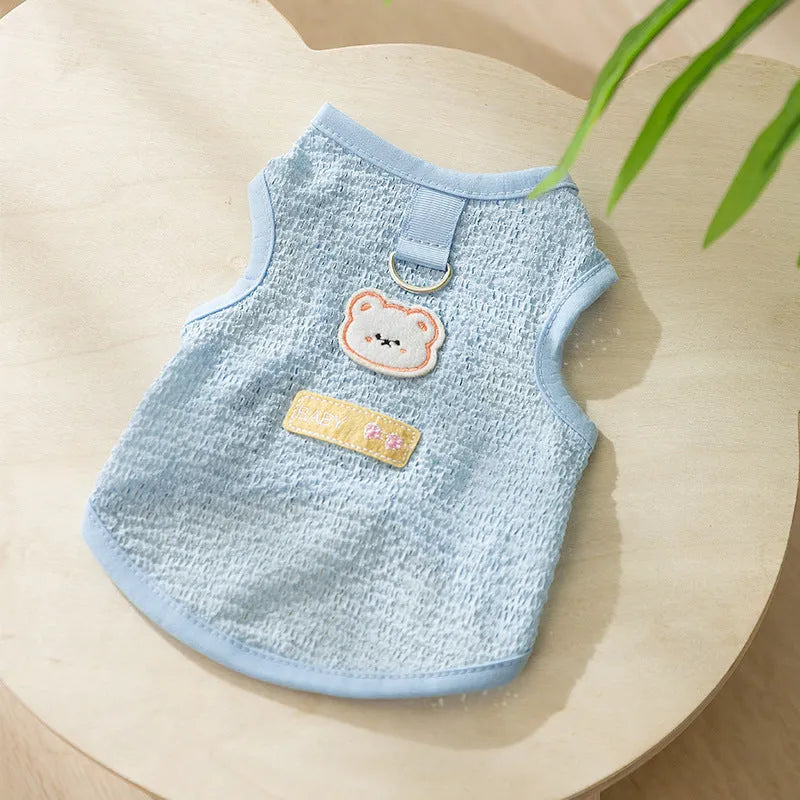 Green knitted cat clothing with a hollowed-out bear patch cartoon design.