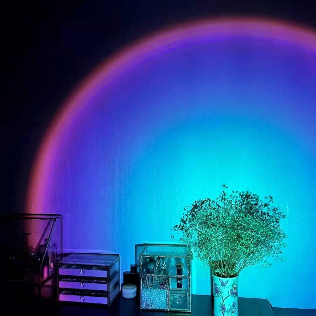 Rechargeable sunset red projection lamp casting rainbow light with push-button switch and USB cable