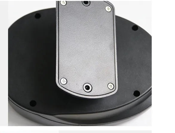 Black 12V car heating fan 7x16cm 150W with cigarette lighter plug on dashboard