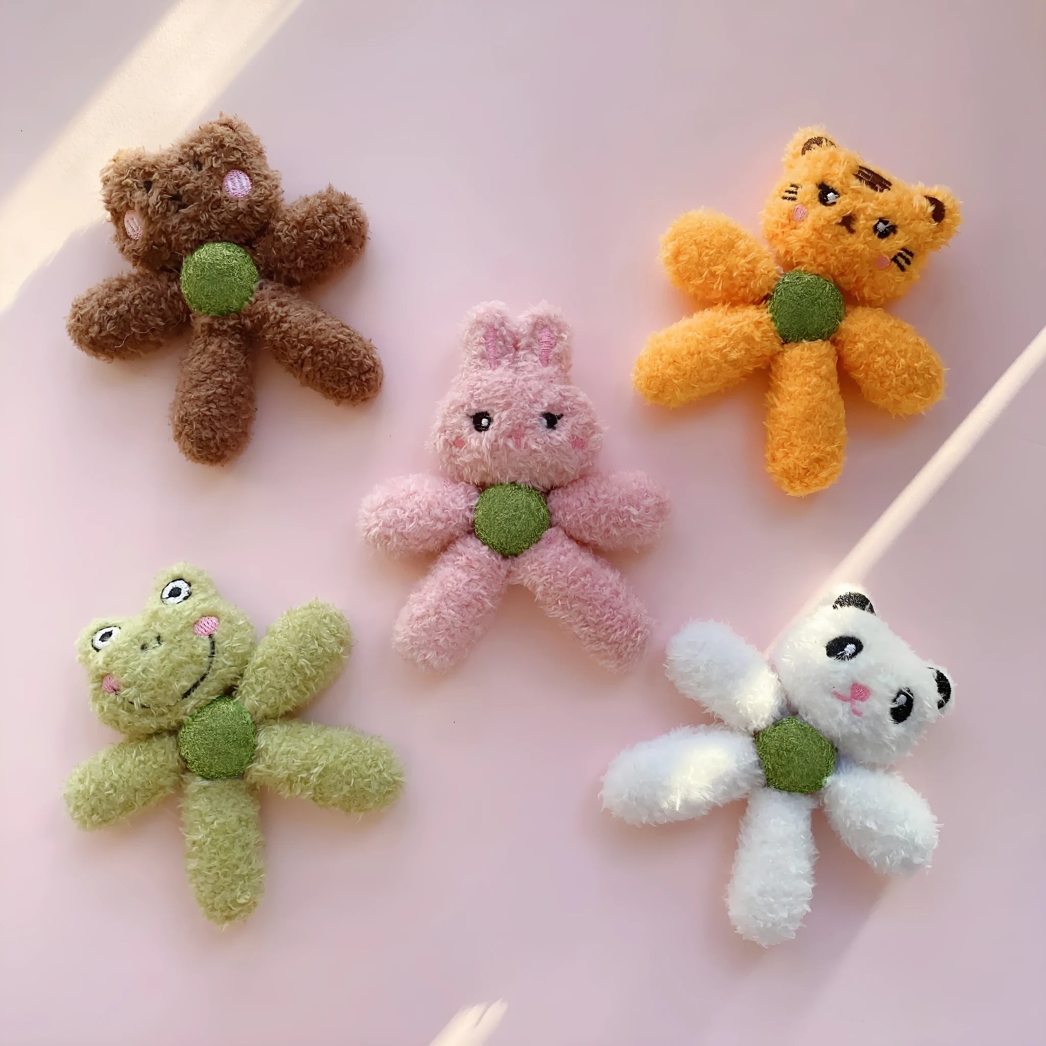 Soft stuffed catnip chewing ball toy for indoor cats, shown in animal designs like panda and bunny.