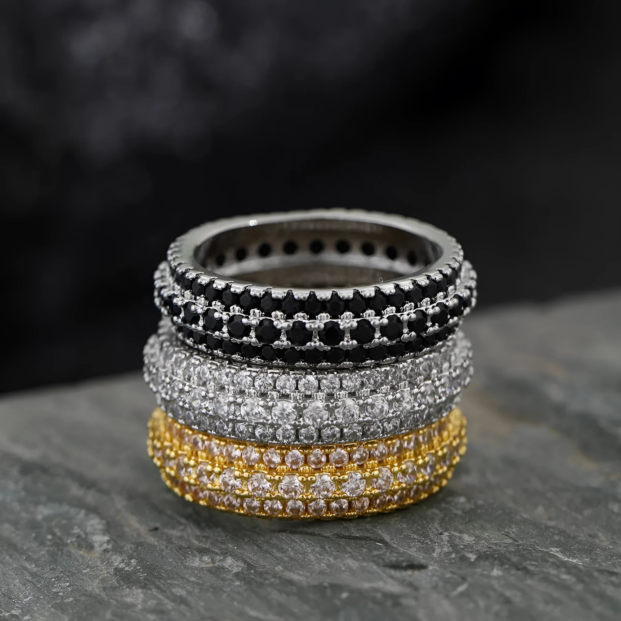 Geometric copper ring with triangular zircon stone and gang drill pattern on band.