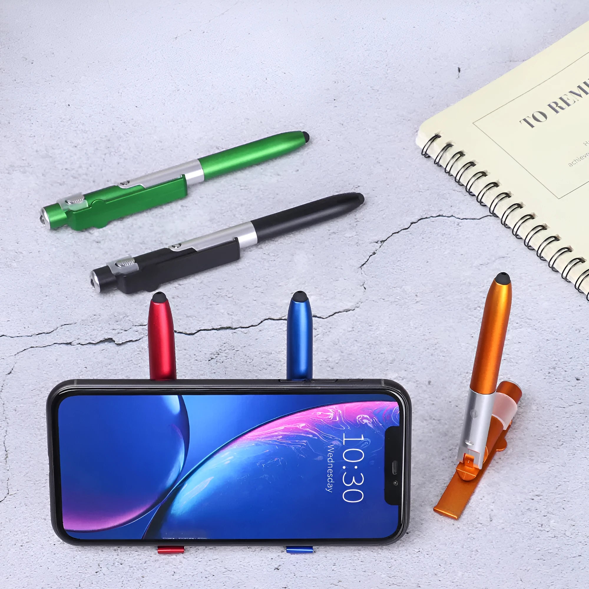 4-in-1 folding light pen mobile phone holder in black plastic, with pen tip and LED light visible