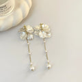 Women's acrylic shell pearl tassel earrings with 8.8cm length and four clip options