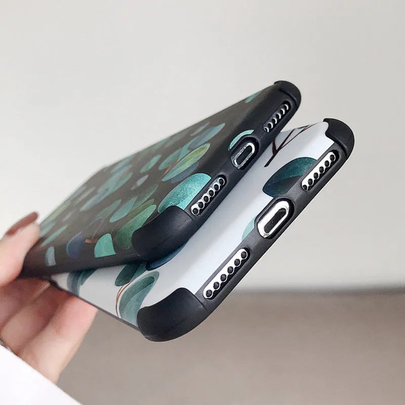 Black silicone iPhone case with a raised leaf pattern on the back.