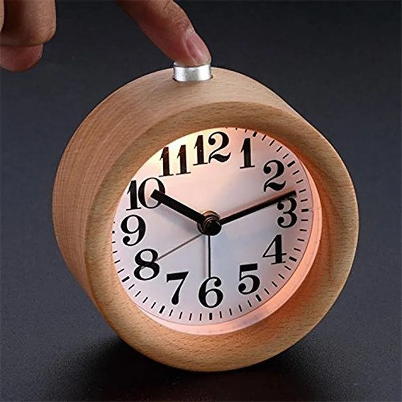 Solid beech wood silent snooze alarm clock showing wooden case and white dial.