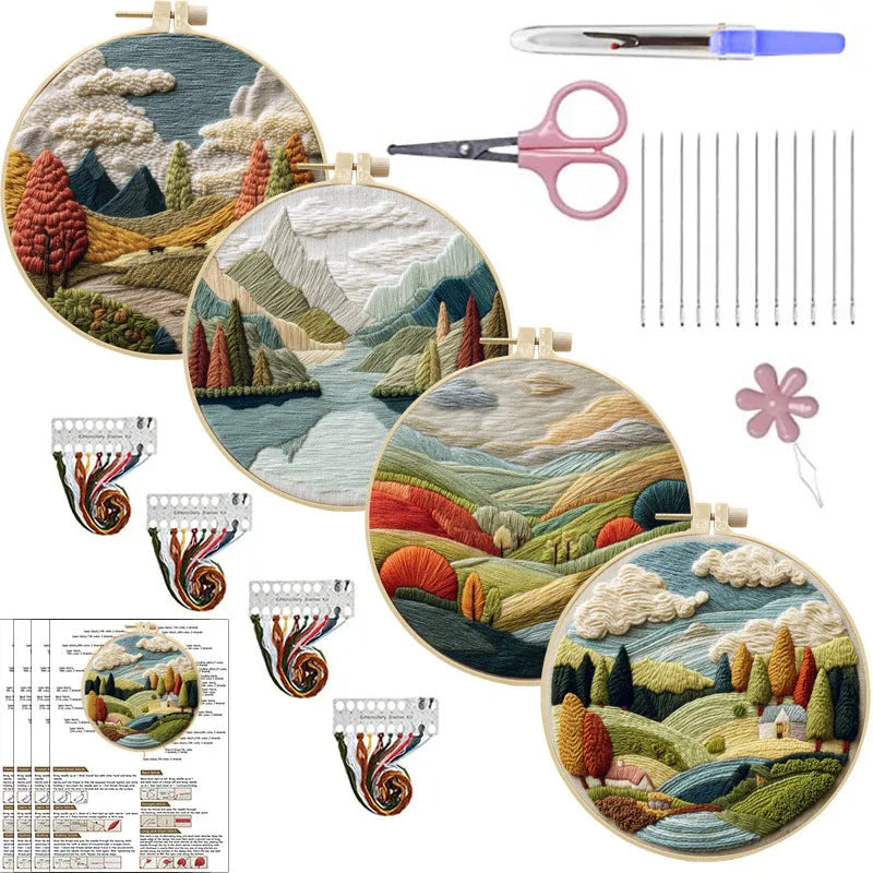 Embroidery DIY kit with cotton landscape fabric, bamboo frame, threads, and tools on wooden surface