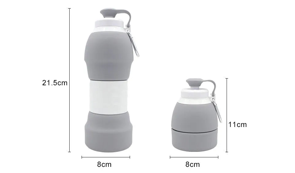 Silicone folding water bottle 580ml in blue, collapsed and full size, with cap, on outdoor background