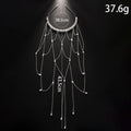 Women's electroplated hair chain with pearl decoration and tassel detailing in gold and silver options