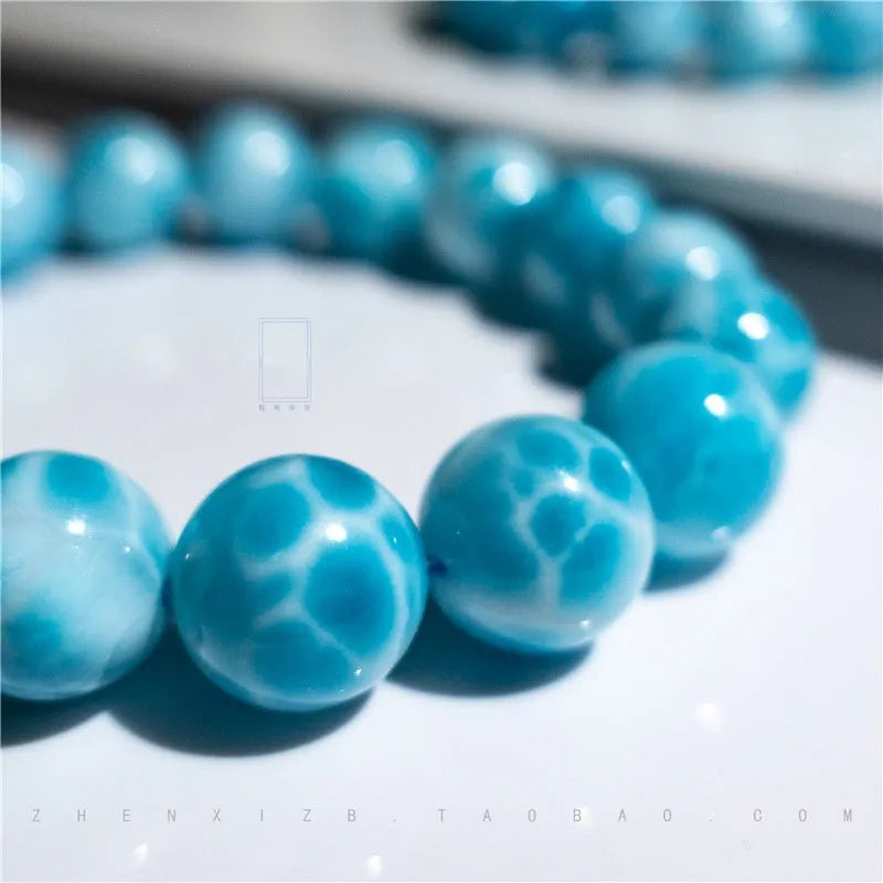 Blue Bodhi bracelet with natural crystal sea-pattern stones and pearl accents in Maillard style design