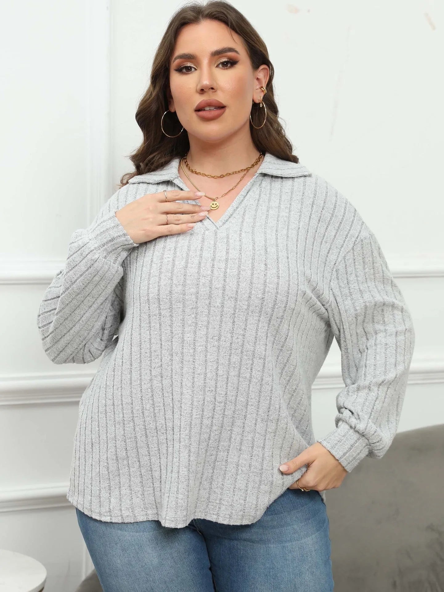 Women's plus size gray polo collar shirt with full lantern sleeves in a street fashion style.