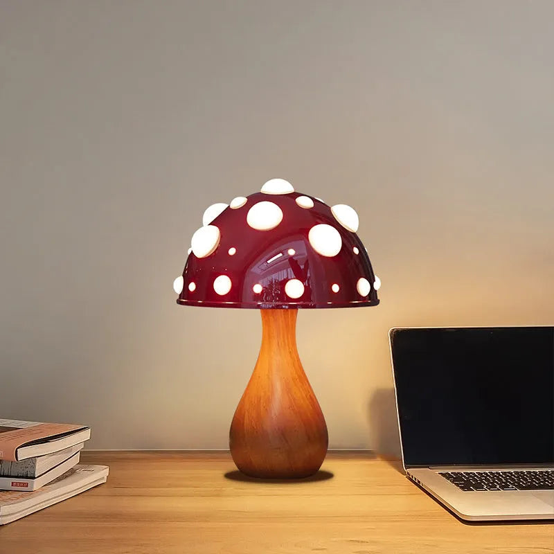Mushroom decorative table lamp with white base and tricolour light on a wooden nightstand