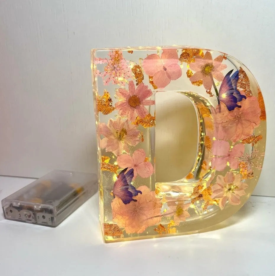 Letter flower transparent resin night light ornament with 15cm dimensions on a table