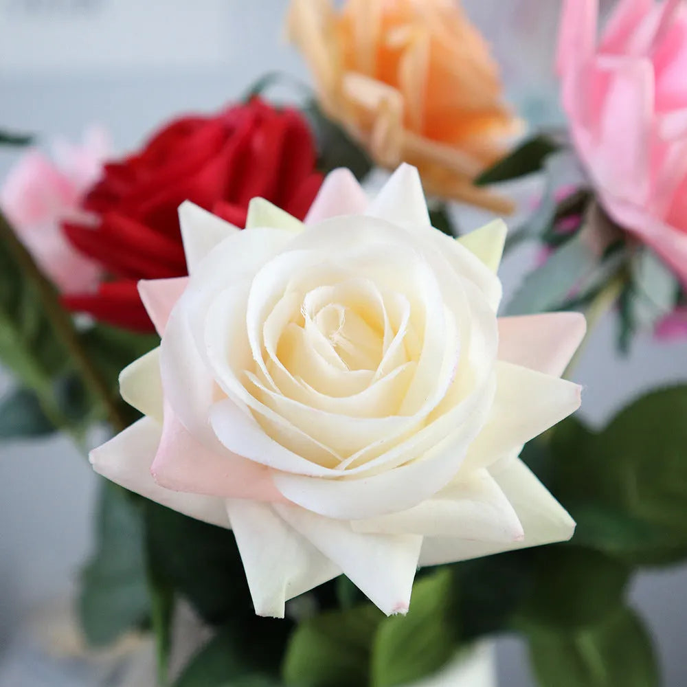 Artificial silk flower bouquet with red petals and green leaves measuring 42cm long