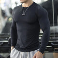 Men's long sleeve black fitness tights in slim fit for running and training.