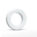 Compact black ring light for smartphones with USB charging port and adjustable settings.