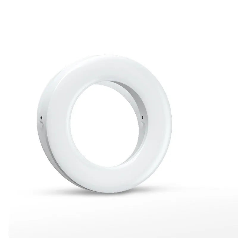 Compact black ring light for smartphones with USB charging port and adjustable settings.