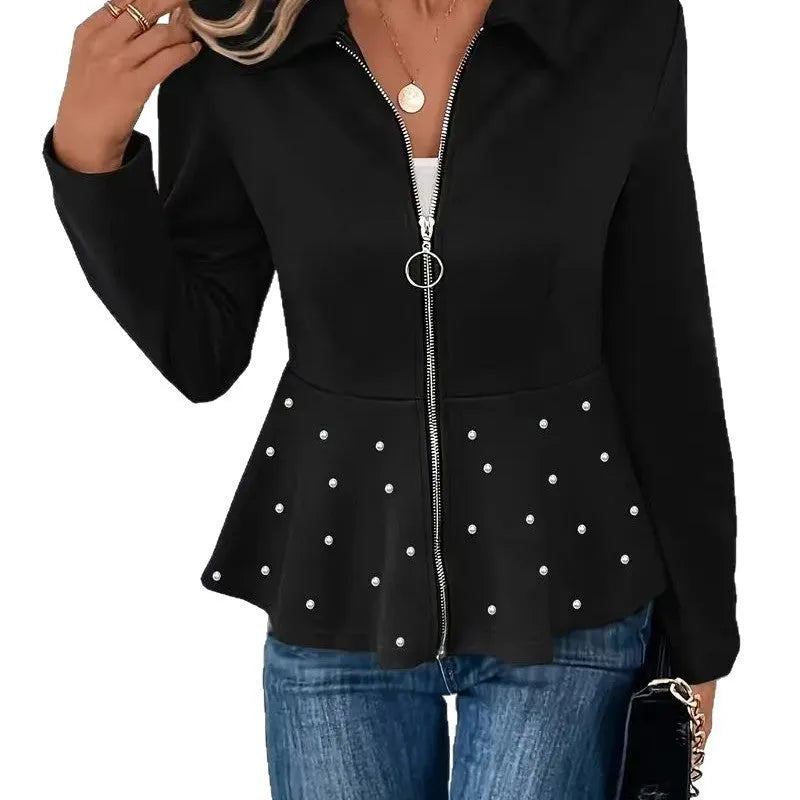 Women's loose black coat with beaded heavy-duty zipper and ruffled hem, shown on a hanger.