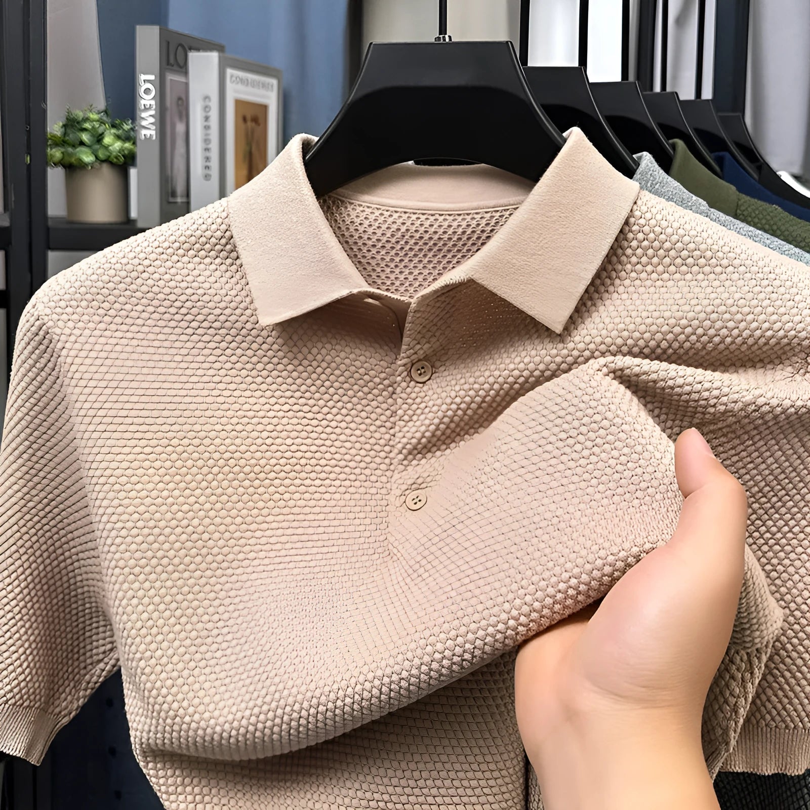 Loose pure cotton short sleeve pullover sweater in grey, shown laid flat.
