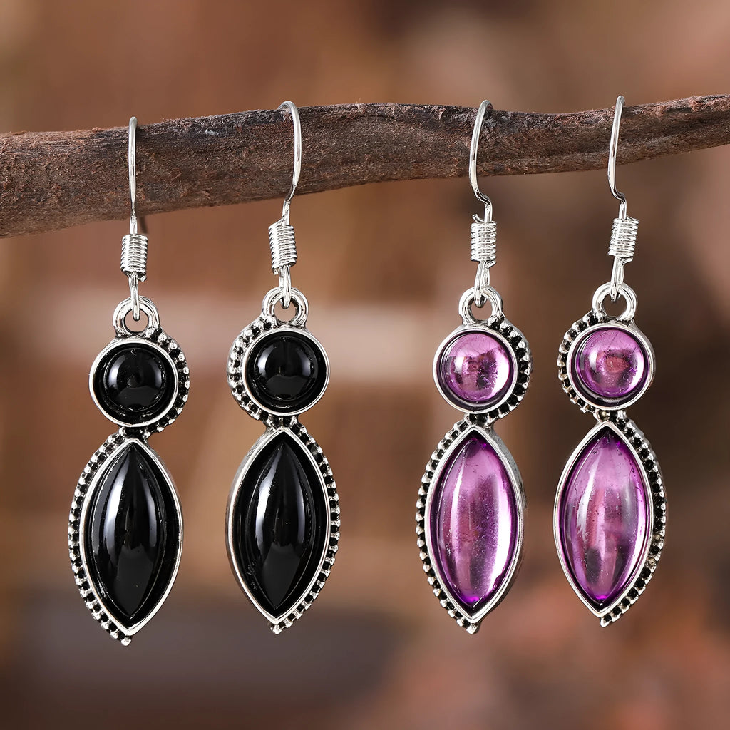 Pair of black and purple geometric vintage pendant earrings with round decorative elements