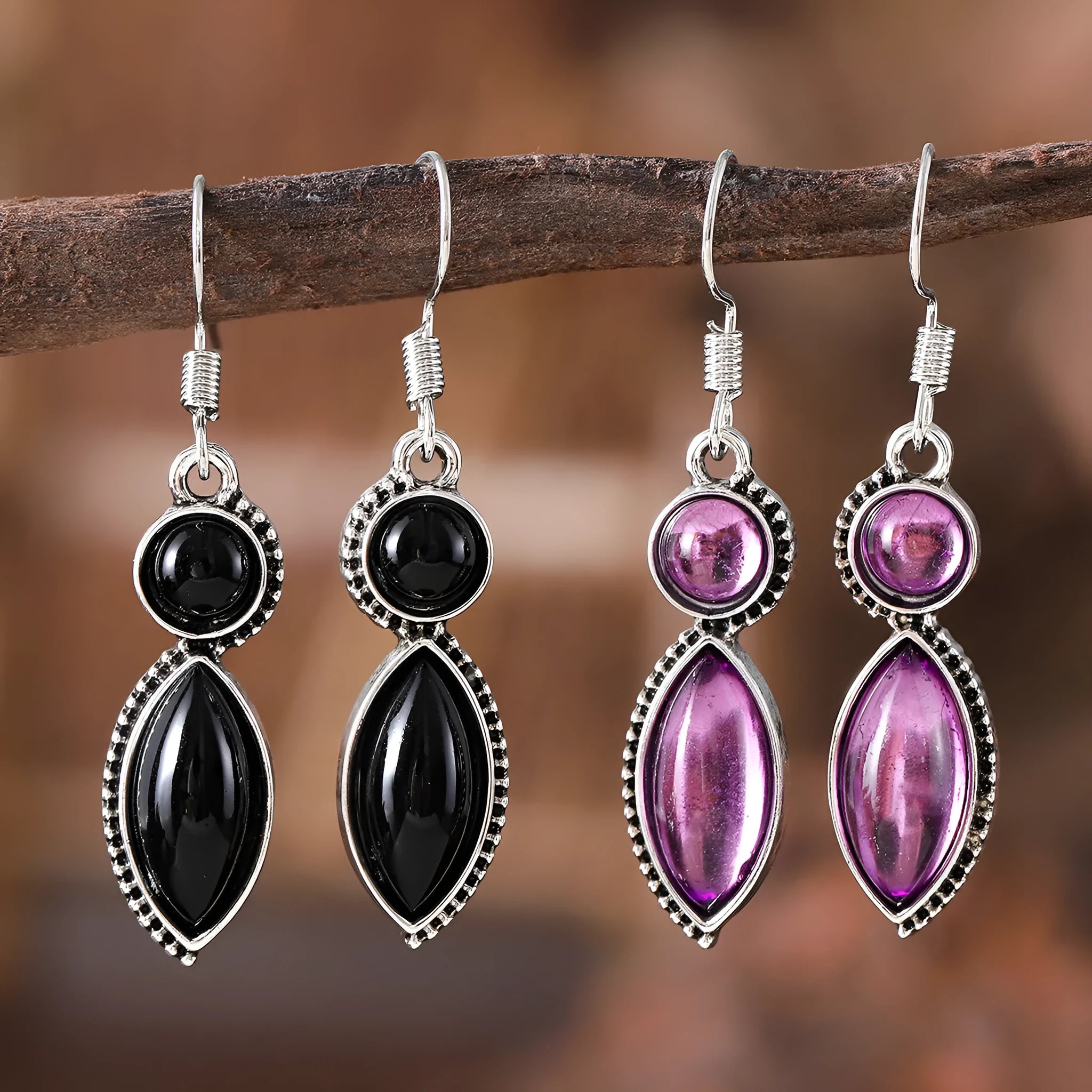 Pair of black and purple geometric vintage pendant earrings with round decorative elements