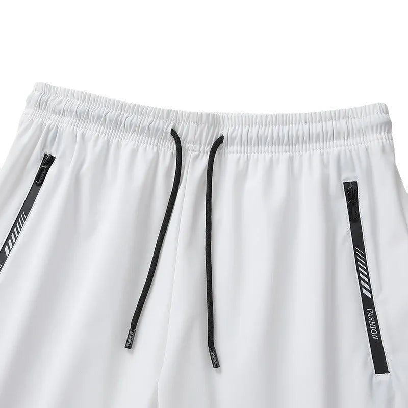 Men's black loose-fit quick-drying nylon sports shorts with a fifth pants length on a white background.