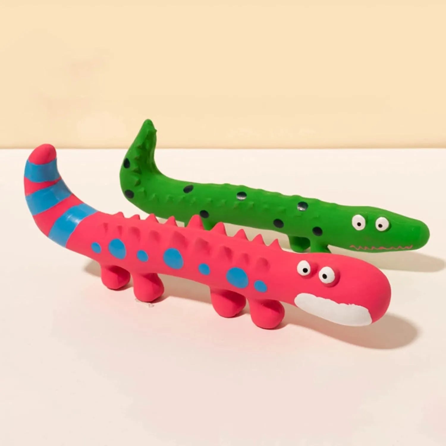Green lizard-shaped dog chew toy with textured latex surface and squeaker function