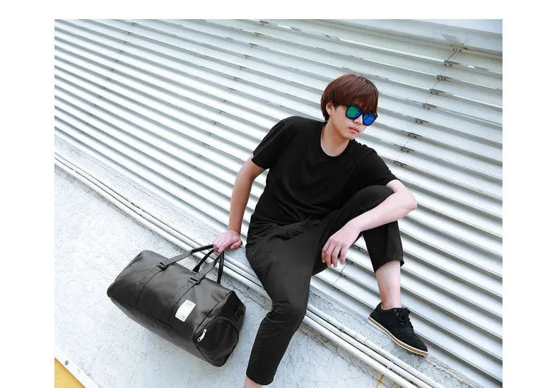 Black waterproof sports bag with separate shoe compartments shown in Large and Small sizes.