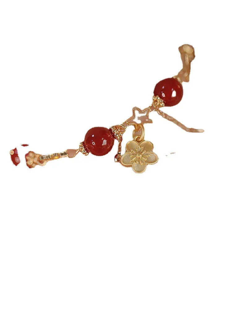Red agate double layer bracelet with peach blossom decoration on female wrist