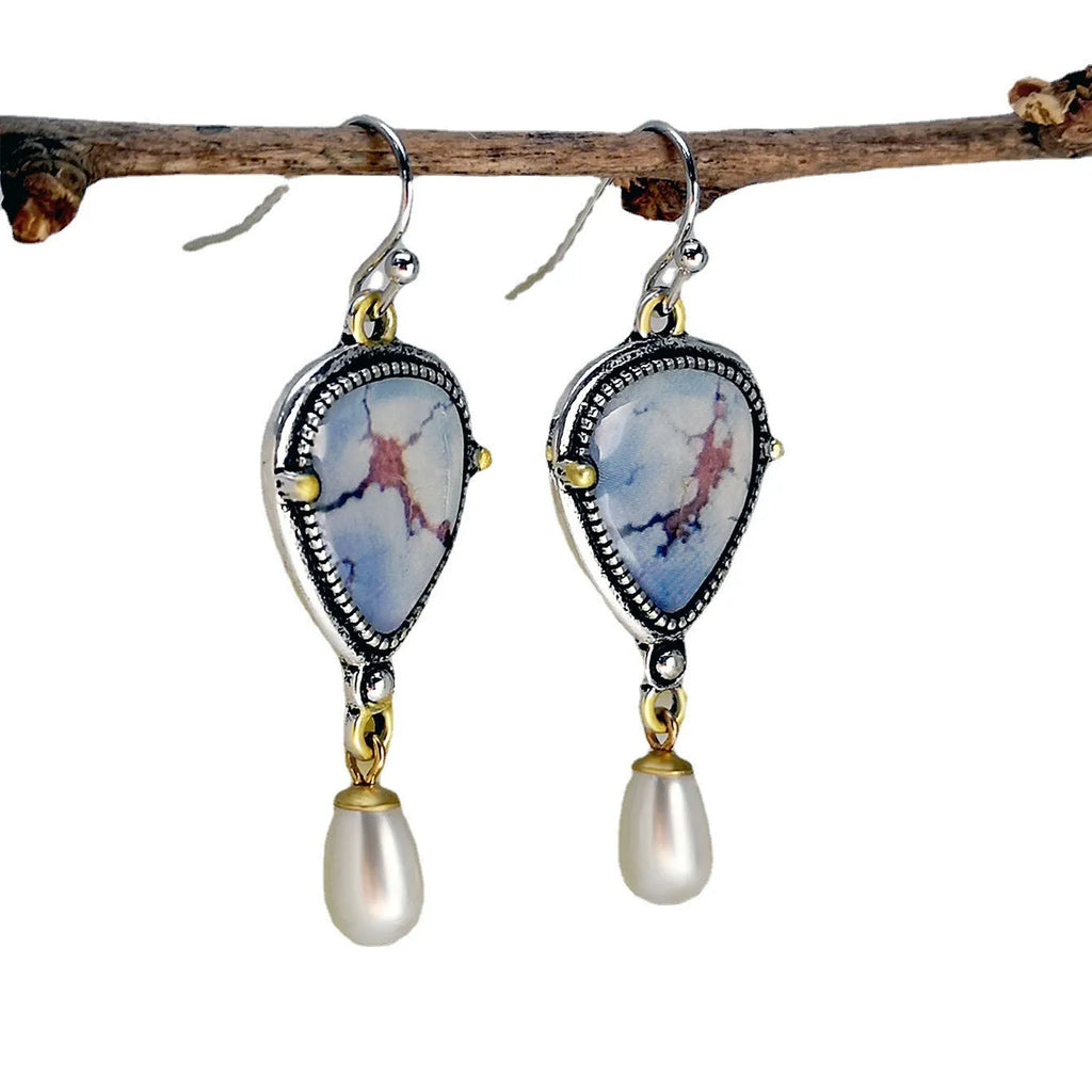 Retro blue geometric drop earrings with synthetic opal and pearl detailing on two-tone electroplated metal
