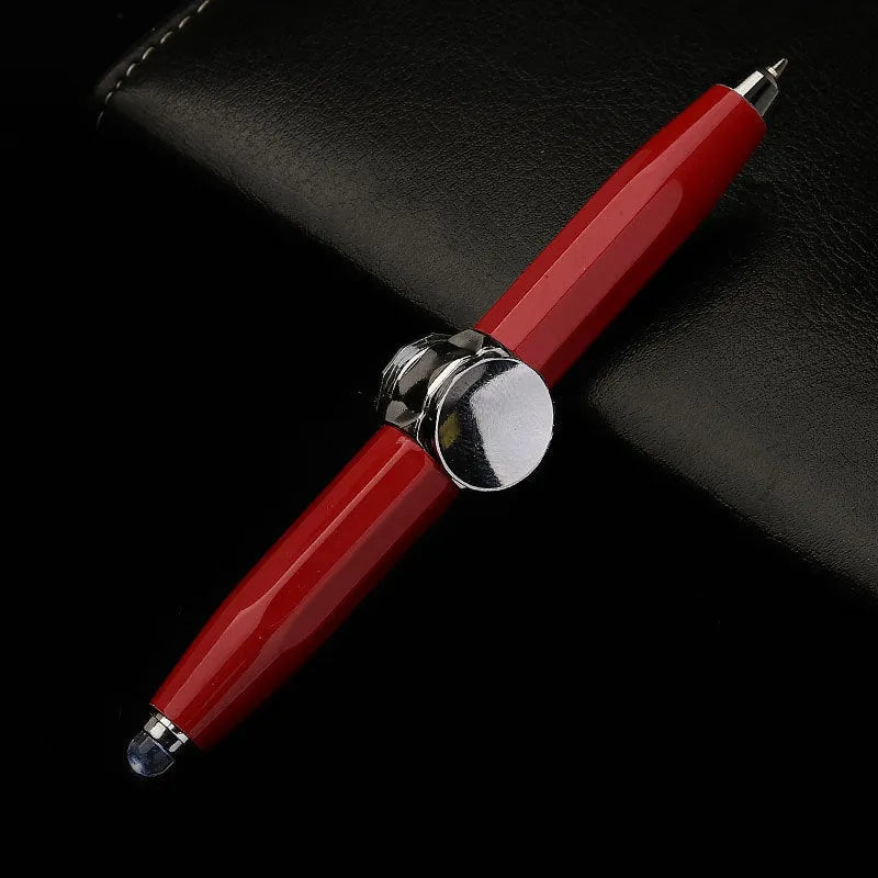A silver metal gyro ballpoint pen with a built-in spinner section, shown with multi-coloured ink refills.